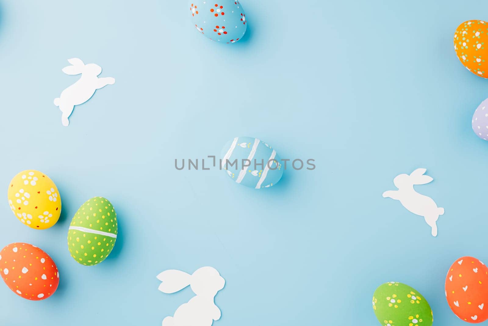 Easter eggs bunny and rabbit white paper cut isolated on blue background copy space, Funny decoration, Creative composition banner web design holiday background, Happy Easter Day, flat lay top view