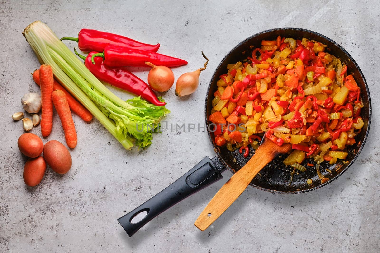 Top view of raw ingredients and ready to eat vegetable ragout