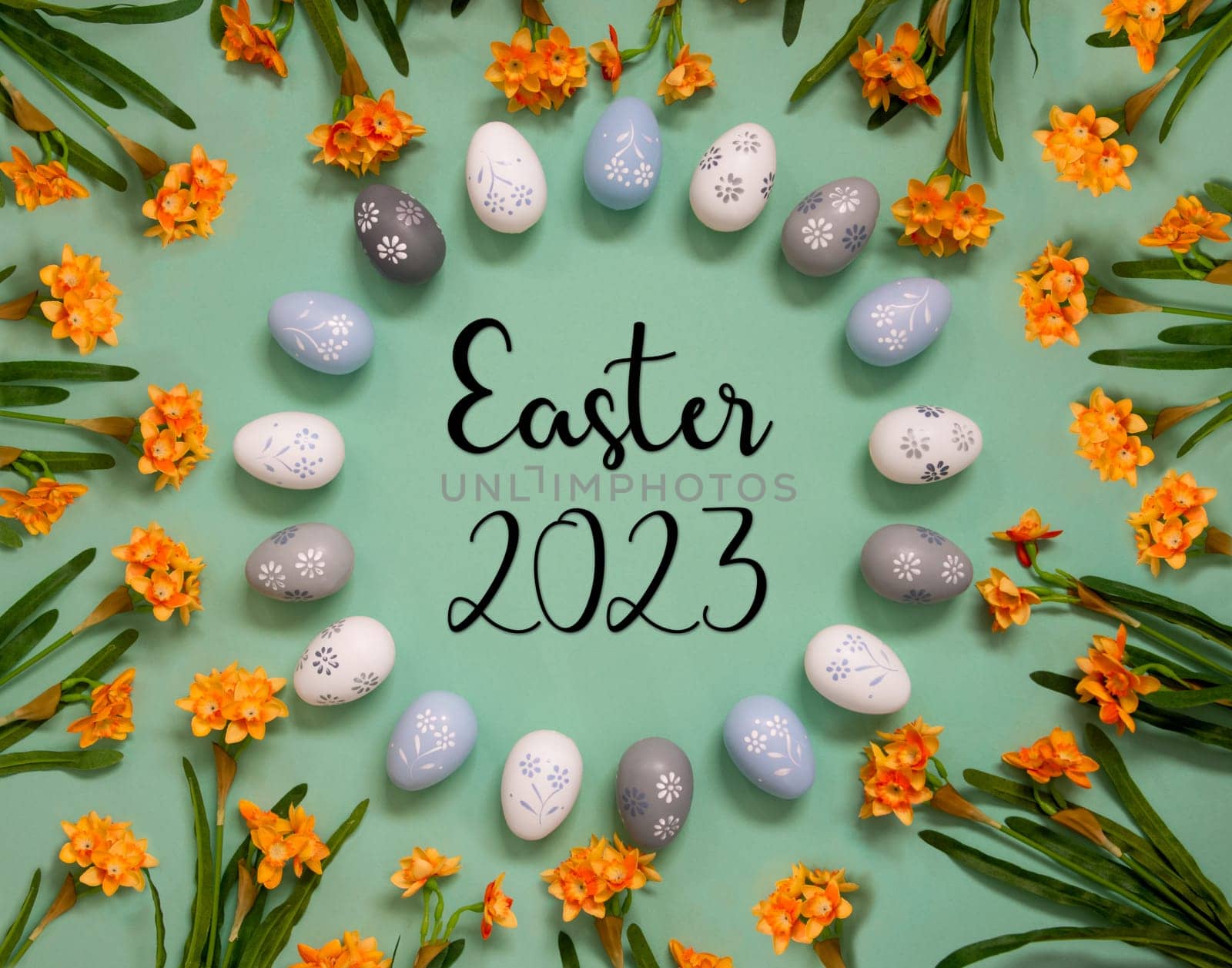 Flat Lay With English Text Easter 2023. Easter Egg Decoration With Orange Spring Flowers. Light Green Paper Background.