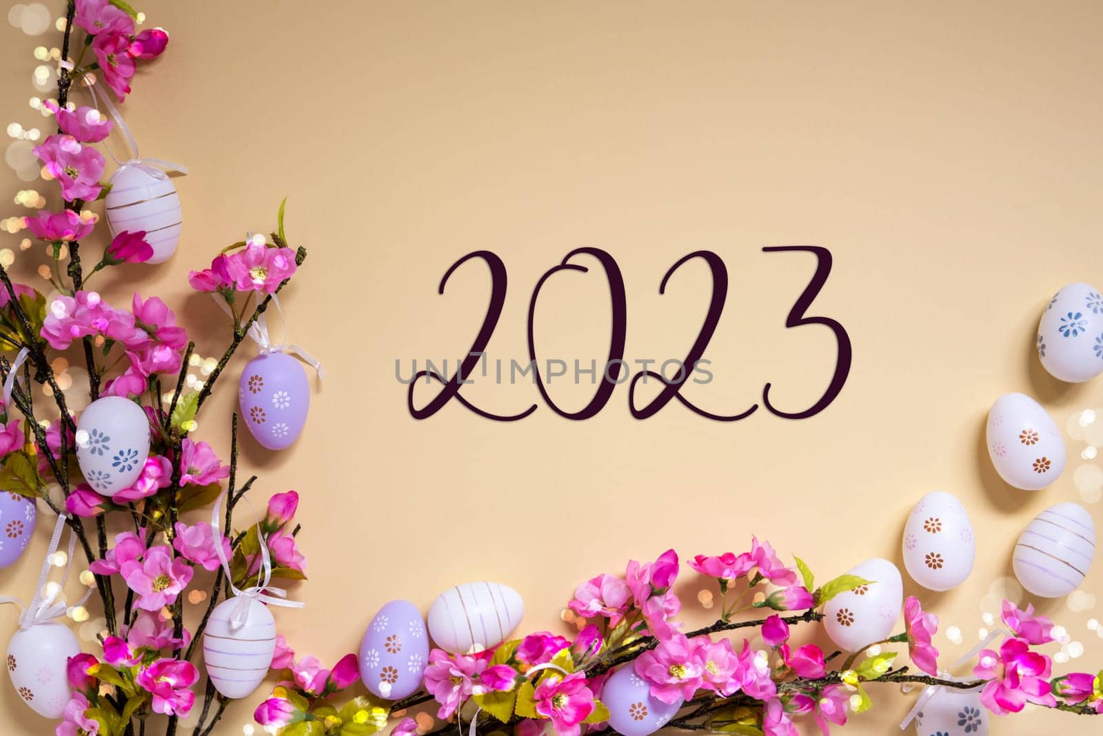 English Text 2023 On Beige Background. Pink And Purple, Shiny And Bright Spring Flower Arrangement With Easter Egg Decoration.