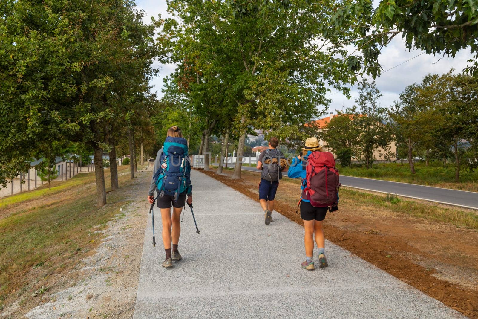 Navarre, Spain, 26 August, 2022: Pilgrims walk along the Camino De Santiago, the Way of St. James pilgrimage route, Navarra, Spain.