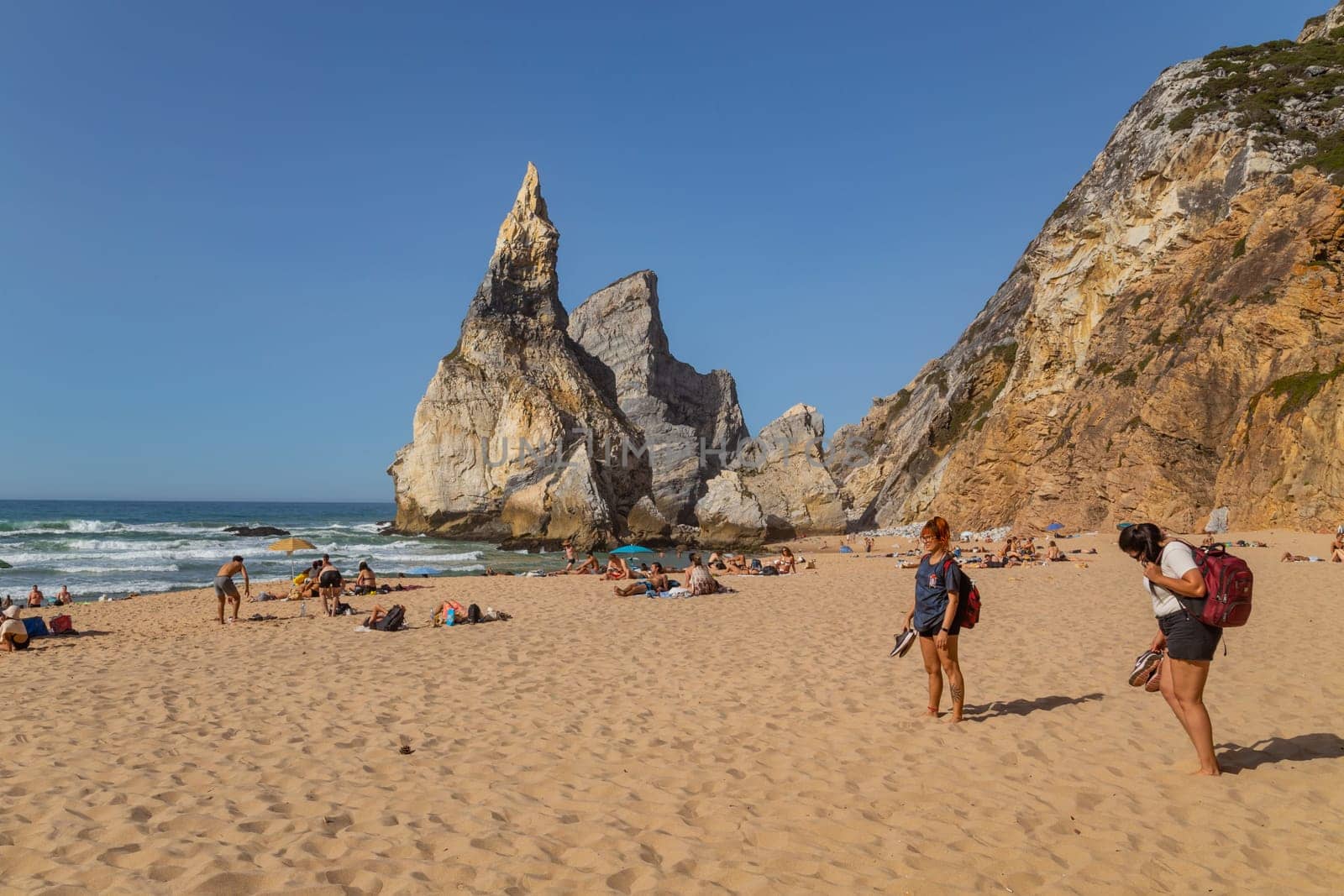 Sintra, Portugal: 22 October 2022 - Praia da Ursa (Ursa Beach) with people, in Sintra near Lisbon in Portugal.