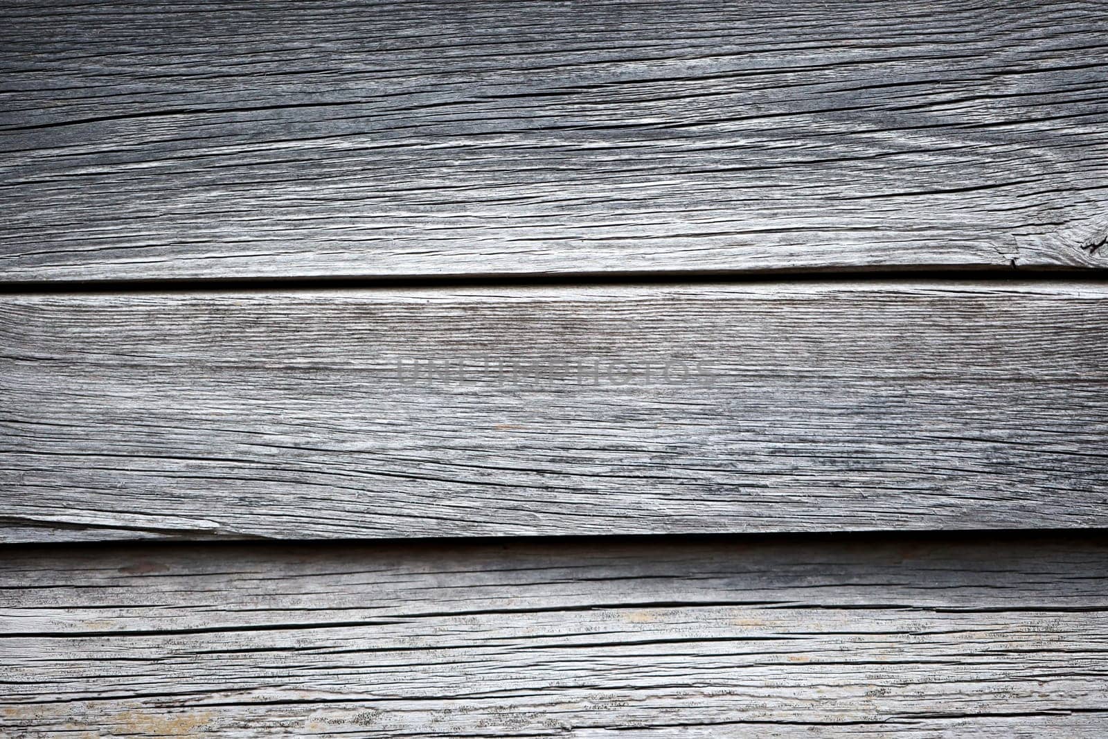 Wooden boards that lie next to each other. A wood texture made of several wooden boards.