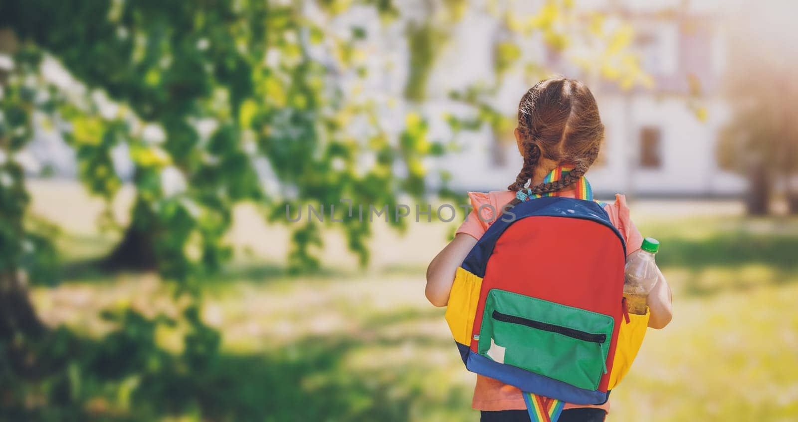 Girl going to study in primary school. Concept of back to school.