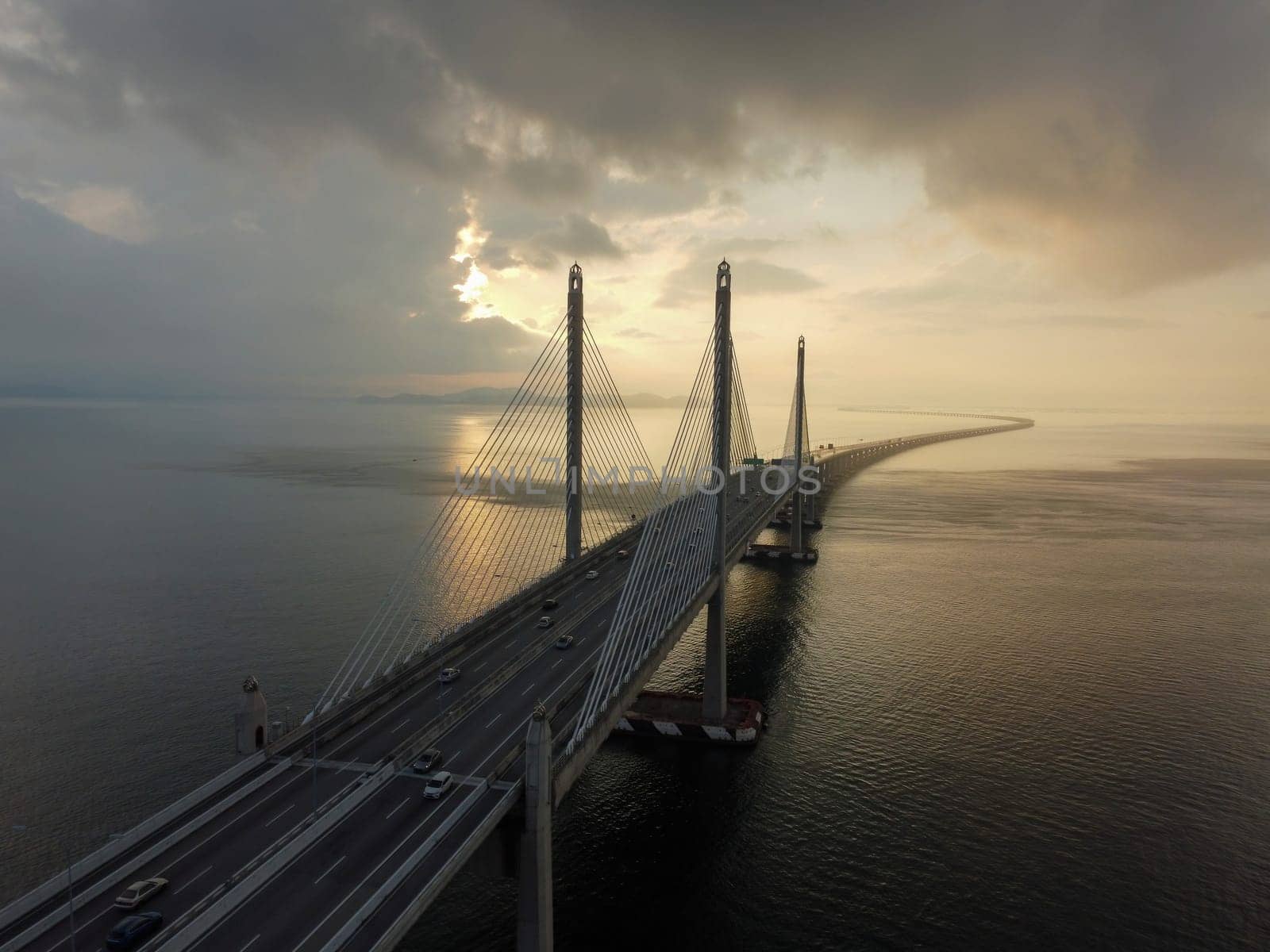 Batu Maung, Penang, Malaysia - Mar 11 2022: Sunrise with dramatic cloud during sunrise at Penang Second Bridge