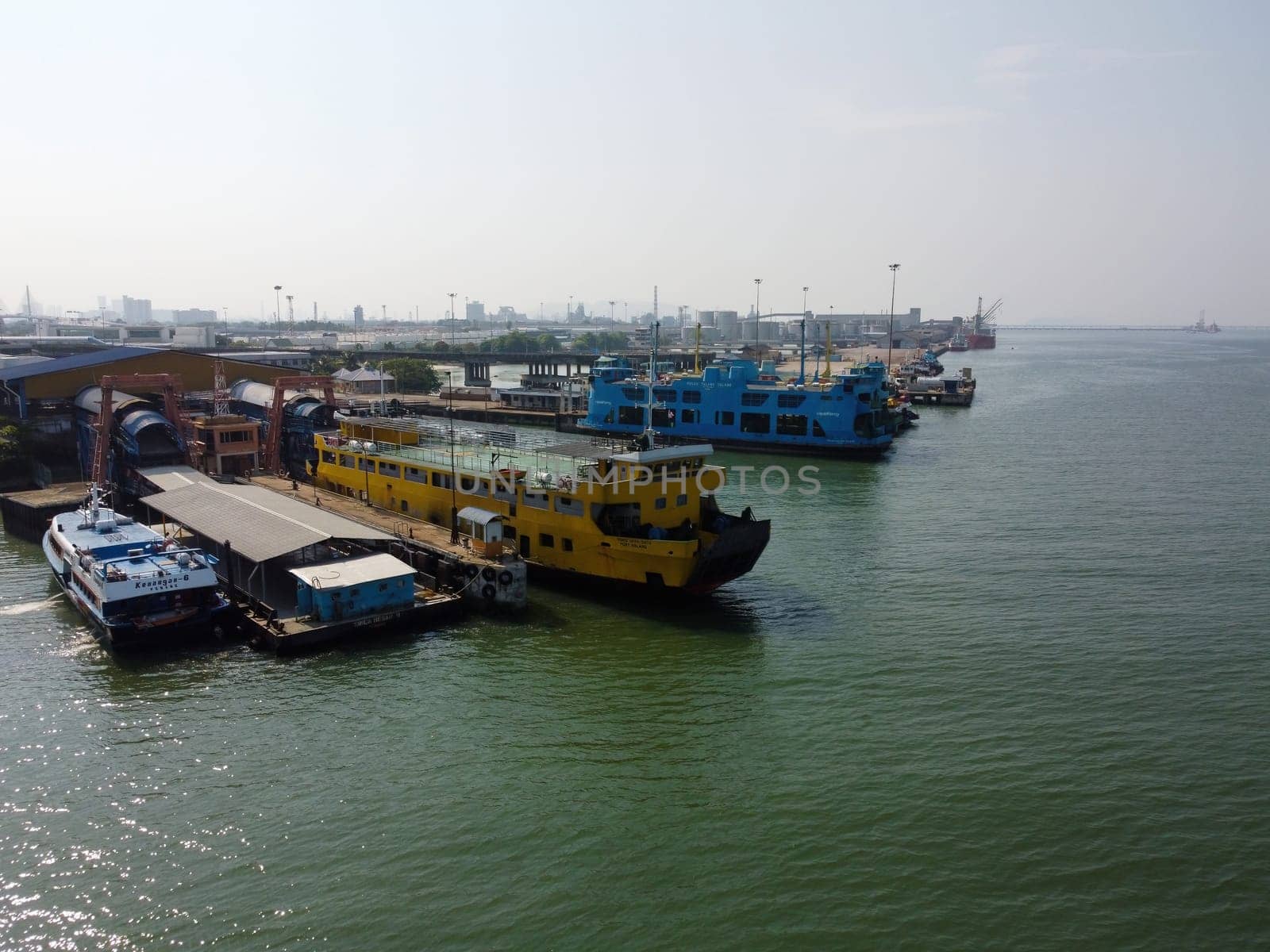 Butterworth, Penang, Malaysia - Mar 12 2022: Yellow roro ferry arrive the jetty at Butterworth