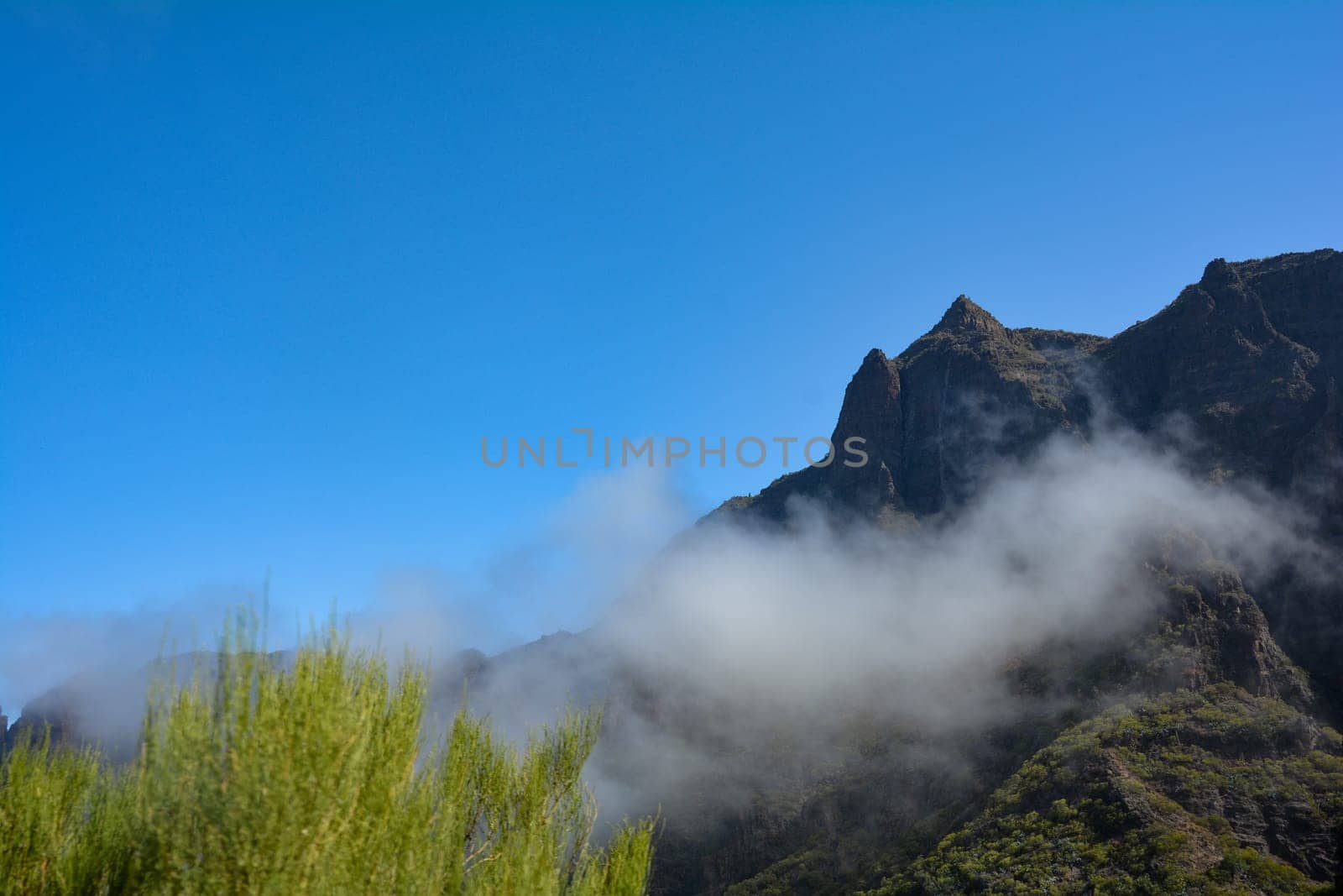 Low hanging clouds in the green Teno Mountains near Masca on the Canary Island of Tenerife, Spain