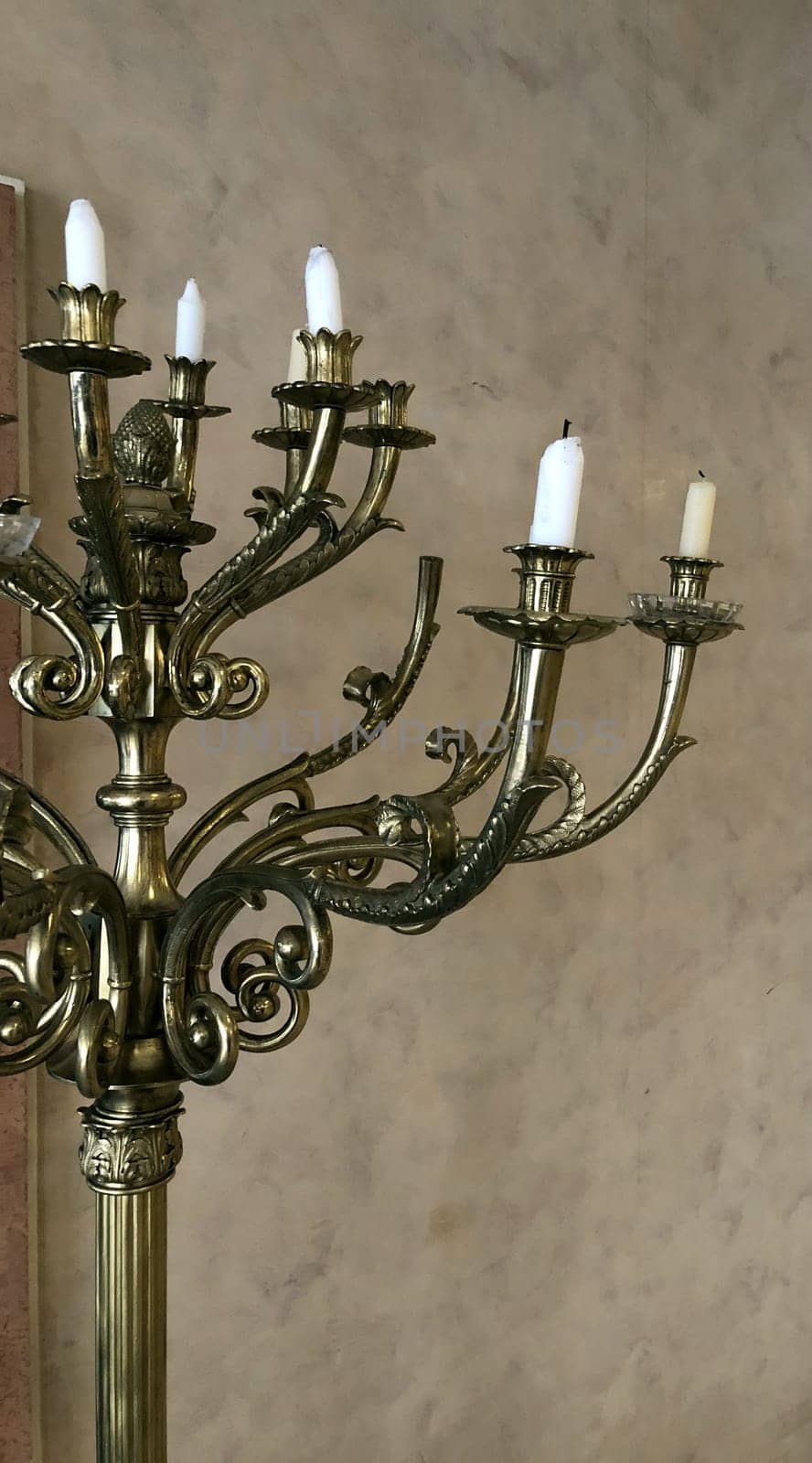 antique bronze candelabra with extinguished candles