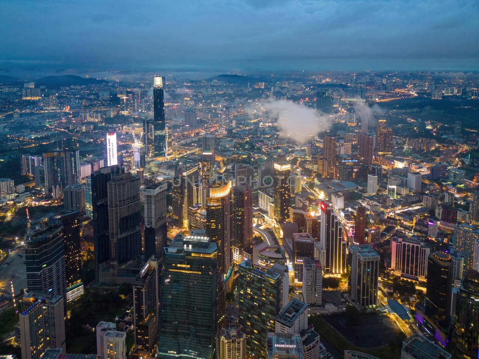 Bukit Bintang, Kuala Lumpur, Malaysia - Nov 12 2022: The vibrant city of Kuala Lumpur comes alive at night with its dazzling lights and bustling streets.