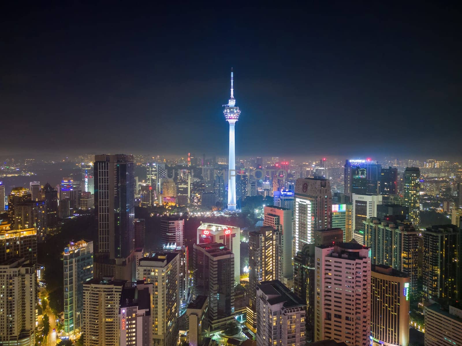 Bukit Bintang, Kuala Lumpur, Malaysia - Nov 29 2022: The city's iconic landmarks, Kuala Lumpur Tower are beautifully lit up