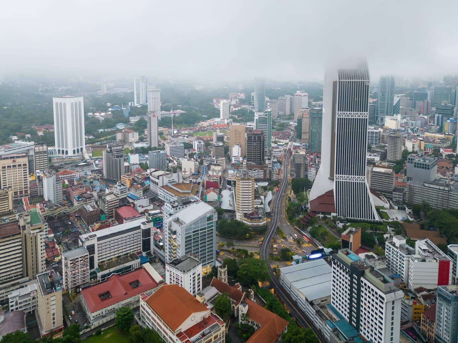 Bukit Bintang, Kuala Lumpur, Malaysia - Dec 03 2022: Aerial view Maybank tower during low cloud foggy morning