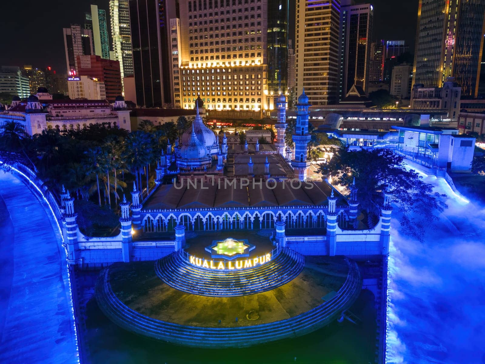 Bukit Bintang, Kuala Lumpur, Malaysia - Dec 03 2022: Aerial view Masjid Jamek with blue led decorated river