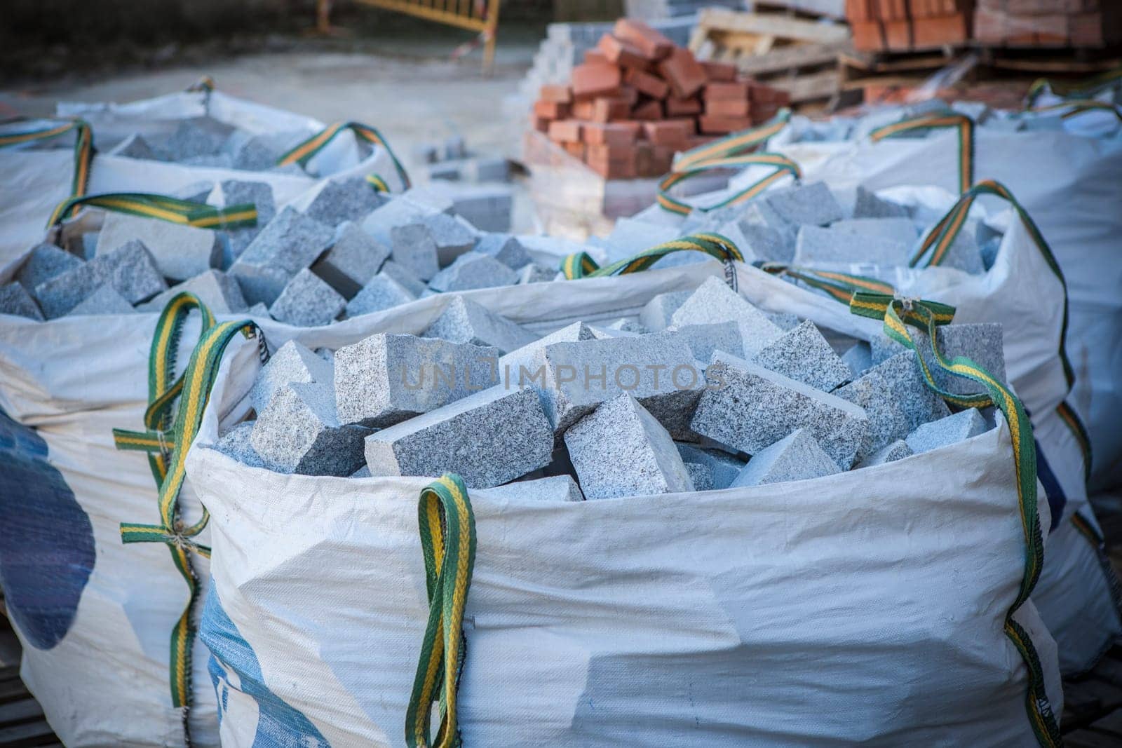 Raffia large sack full of granite cobblestones. Construction material concept