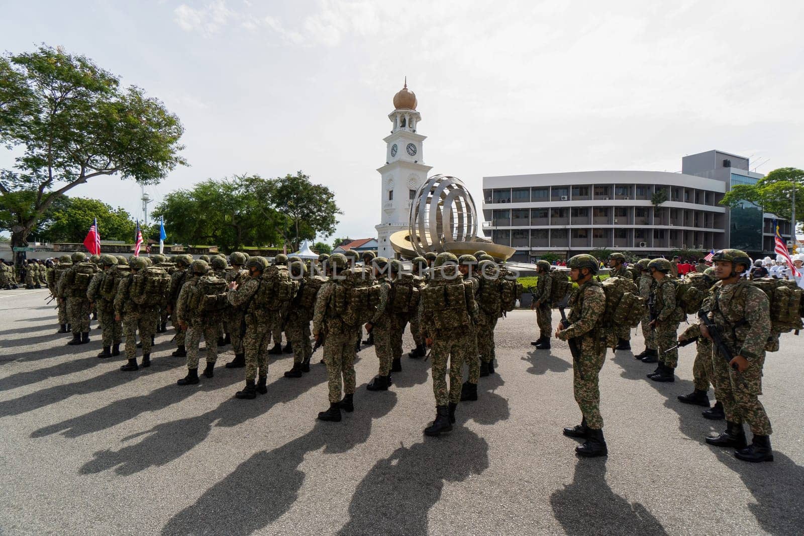 George Town, Penang, Malaysia - Aug 29 2022: Soldier stand at street during procession under sunny day