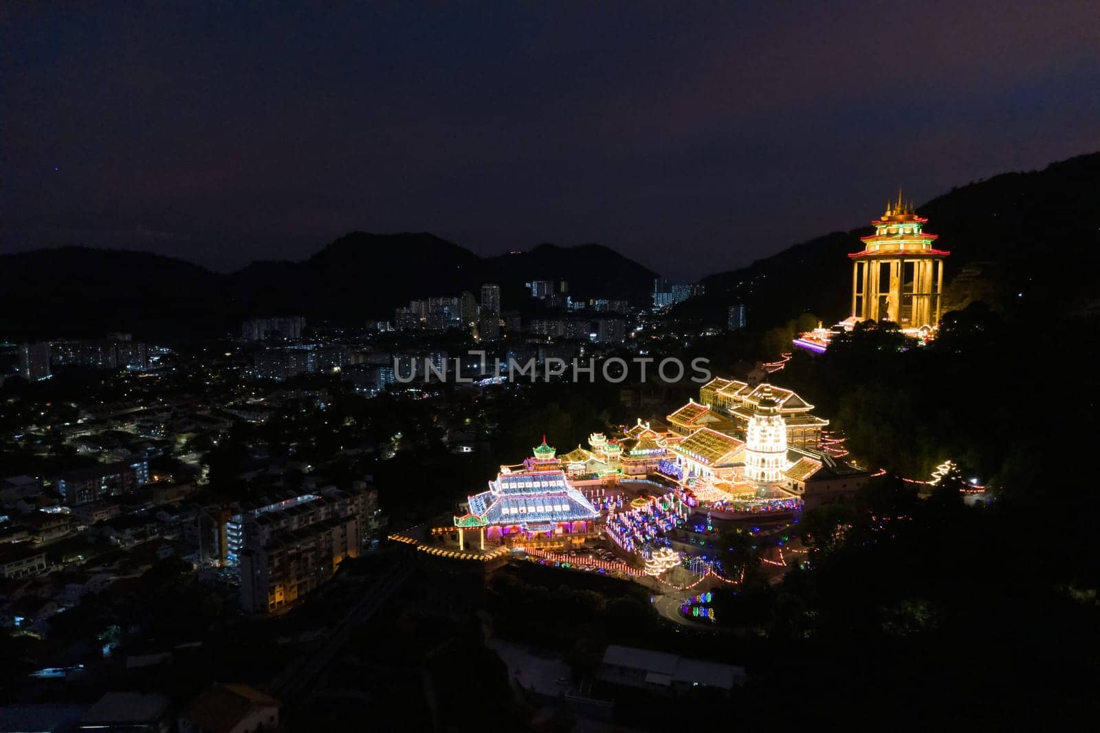 Ayer Itam, Penang, Malaysia - Feb 20 2022: Kek Lok Si temple with beauty led light. Background is Ayer Itam town