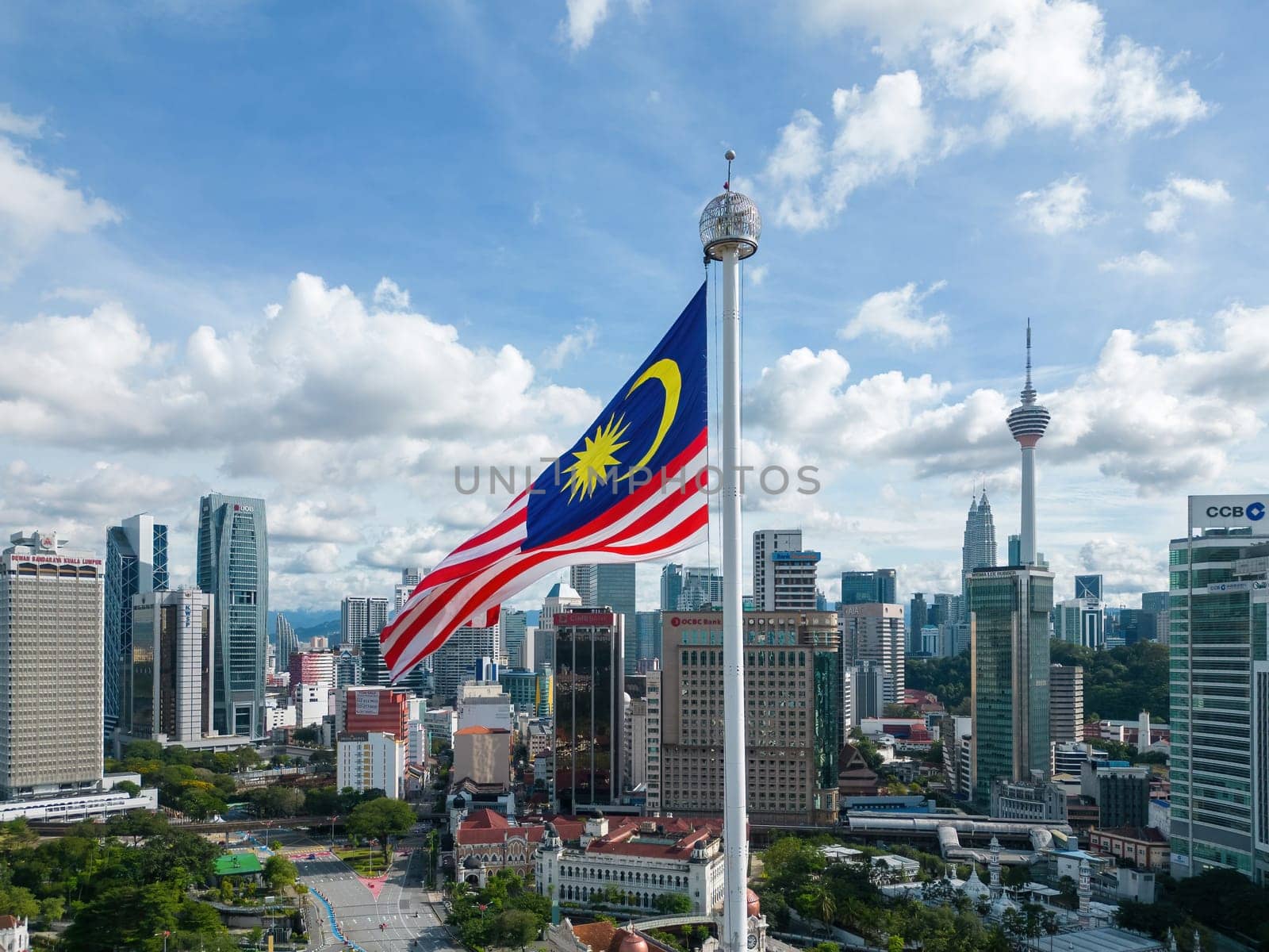 Bukit Bintang, Kuala Lumpur, Malaysia - Dec 05 2022: Malaysia flag at Dataran merdeka with background of Kuala Lumpur city