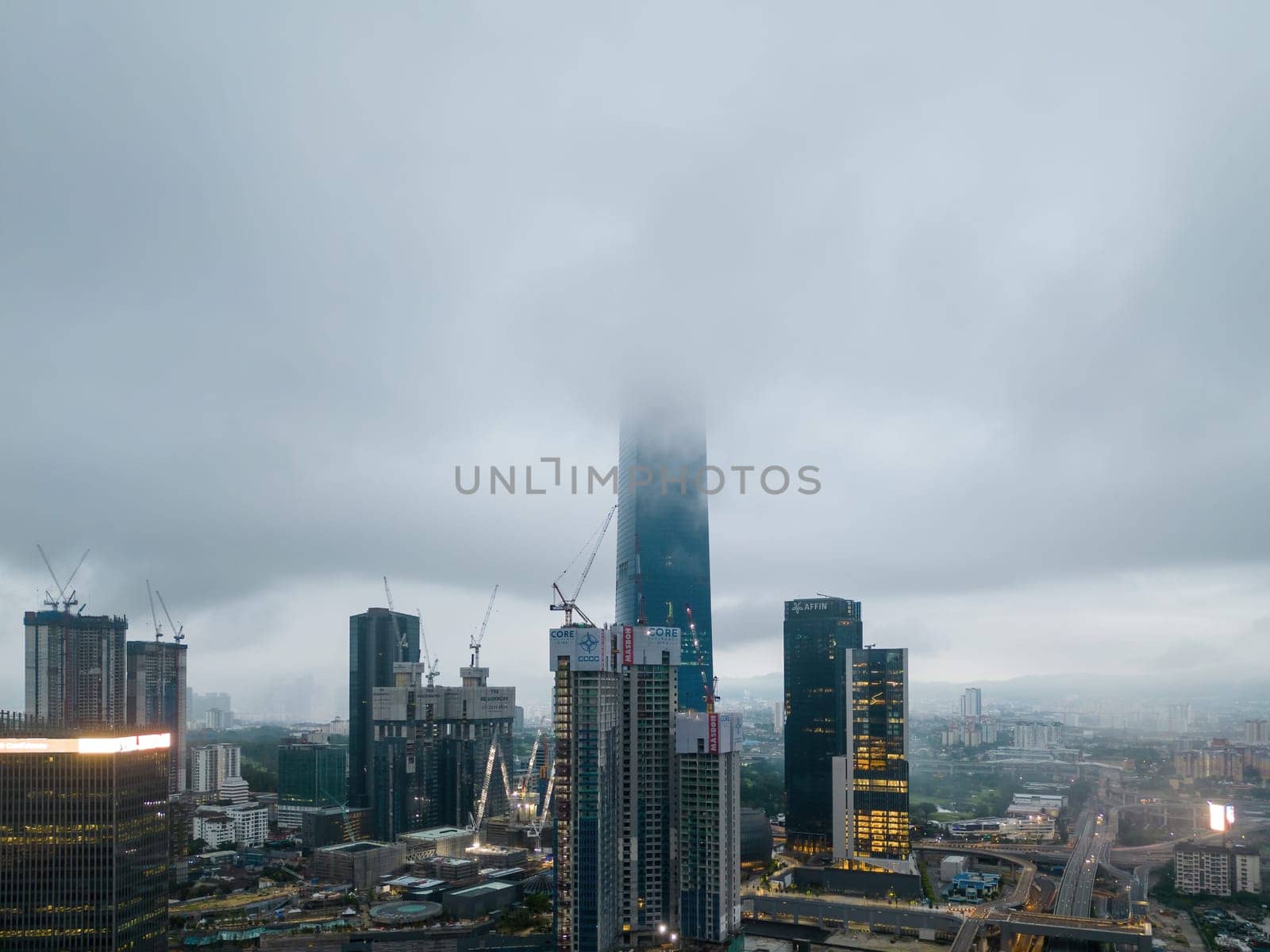 Bukit Bintang, Kuala Lumpur, Malaysia - Dec 03 2022: The low clouds seem to envelop the building, giving it an ethereal quality that's hard to miss.