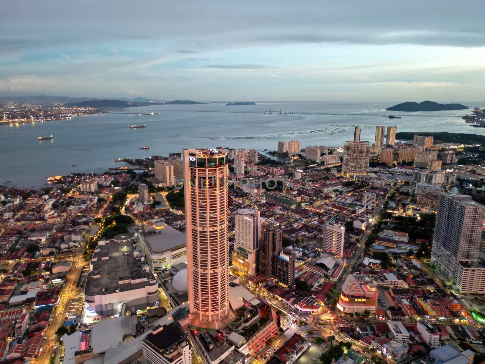 George Town, Penang, Malaysia - Sep 26 2022: Aerial view illuminated Komtar building in blue hour