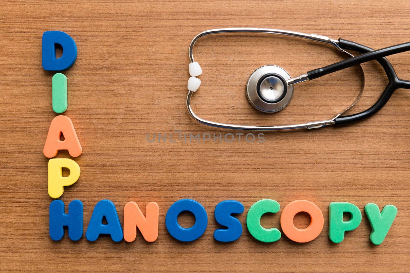 diaphanoscopy colorful medical word and stethoscope on the wooden background