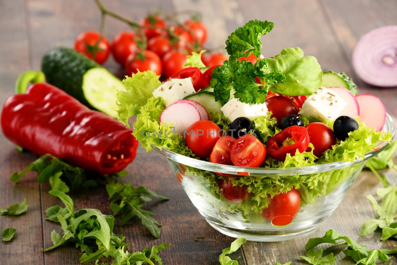 Vegetable salad bowl on kitchen table. Balanced diet.