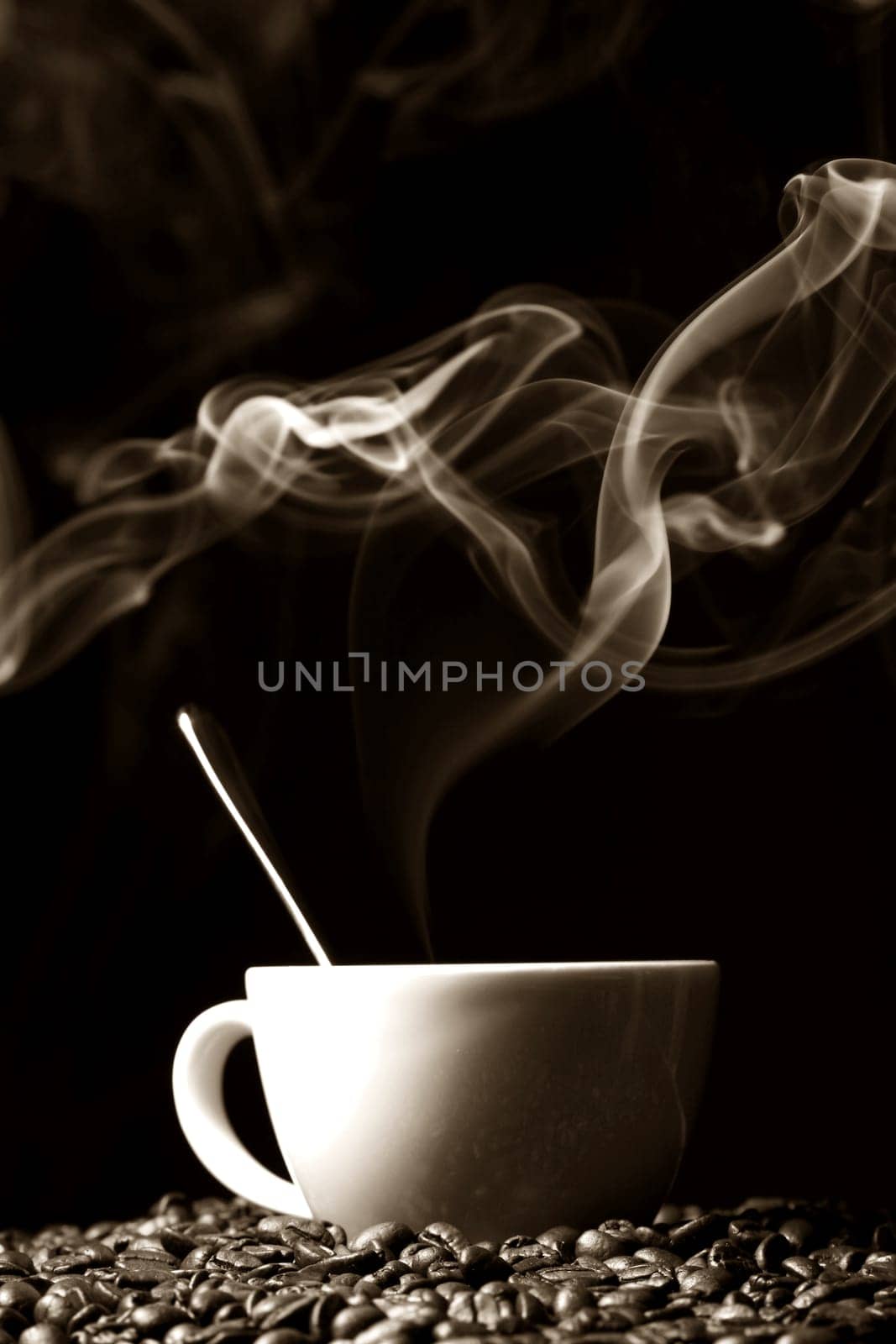 coffee beans and white hot cup of drink