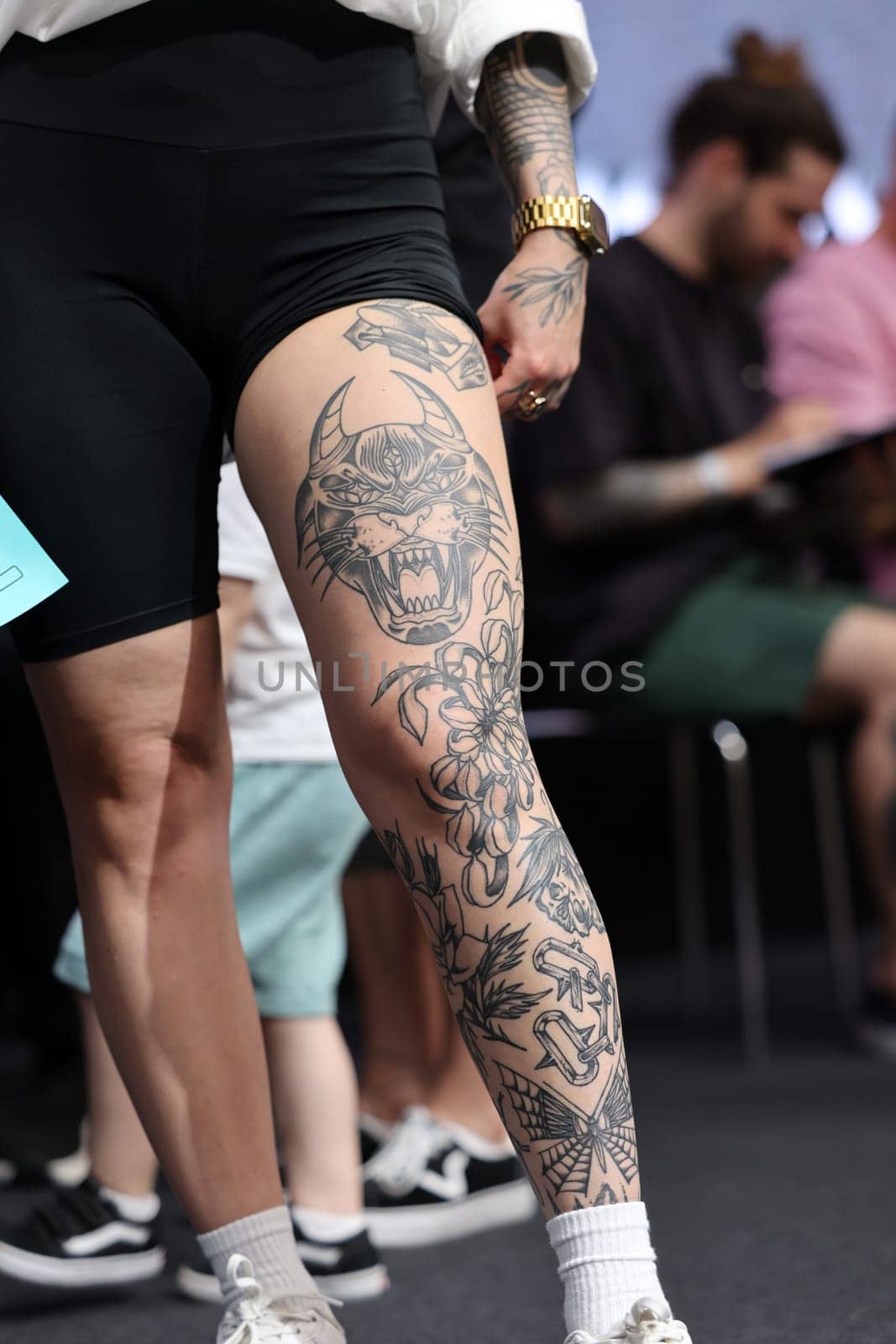 Krakow, Poland - June 11, 2022: Unidentified participant during the contest for the best tattoo at the 15th Tattoofest Convention in Cracow. One of the most prestigious tattoo festivals.