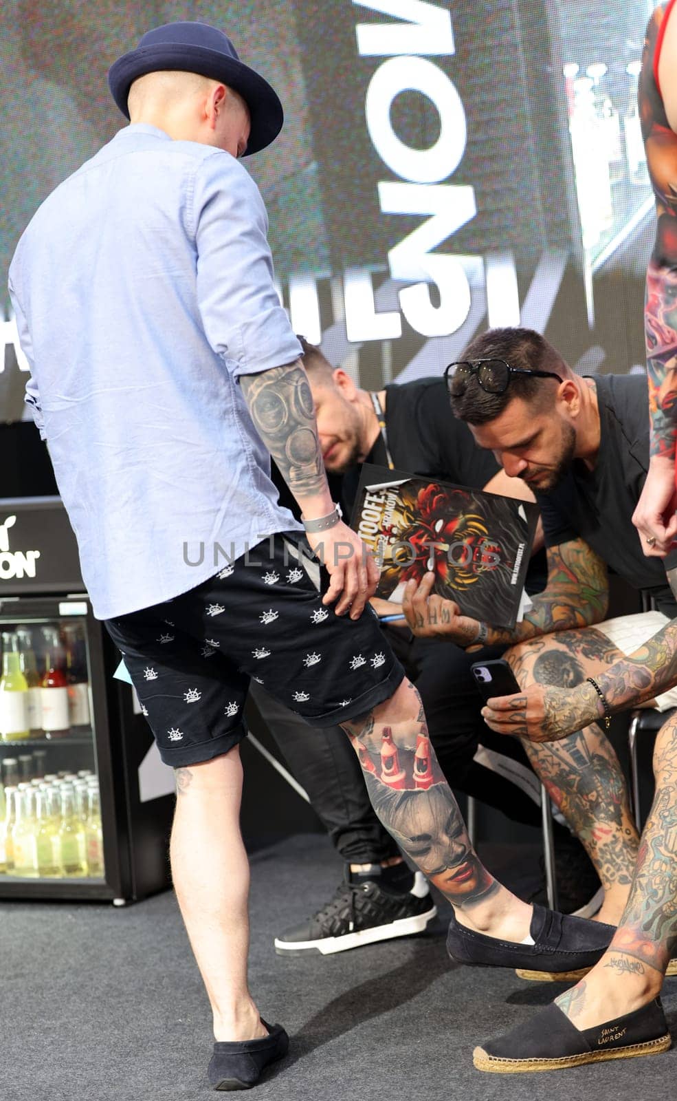 Krakow, Poland - June 12, 2022: Unidentified participant during the contest for the best tattoo at the 15th Tattoofest Convention in Cracow. One of the most prestigious tattoo festivals.