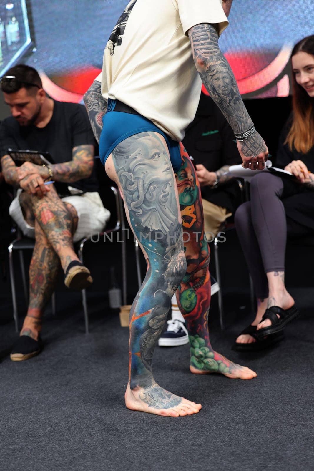 Krakow, Poland - June 12, 2022: Unidentified participant during the contest for the best tattoo at the 15th Tattoofest Convention in Cracow. One of the most prestigious tattoo festivals.