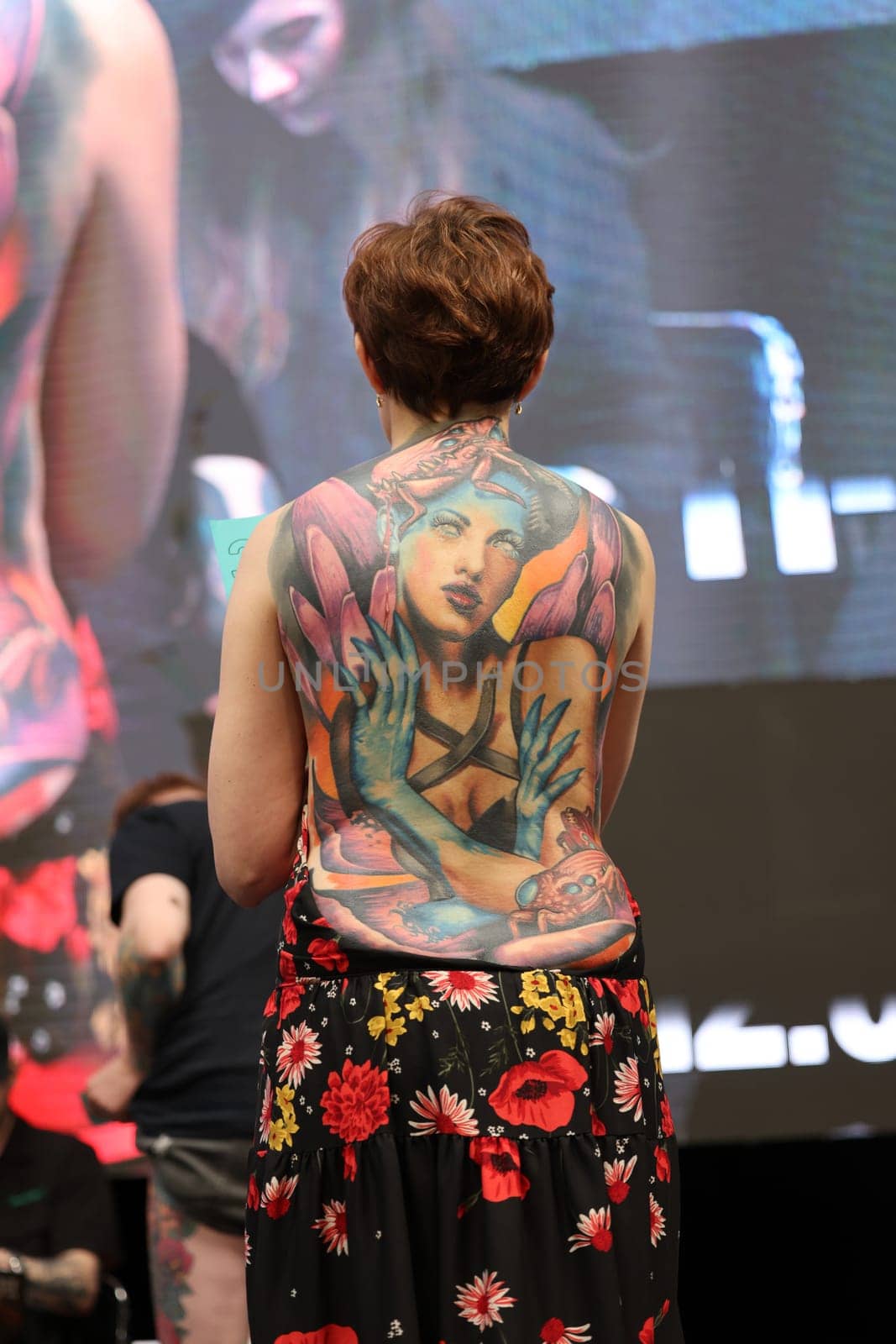 Krakow, Poland - June 12, 2022: Unidentified participant during the contest for the best tattoo at the 15th Tattoofest Convention in Cracow. One of the most prestigious tattoo festivals.
