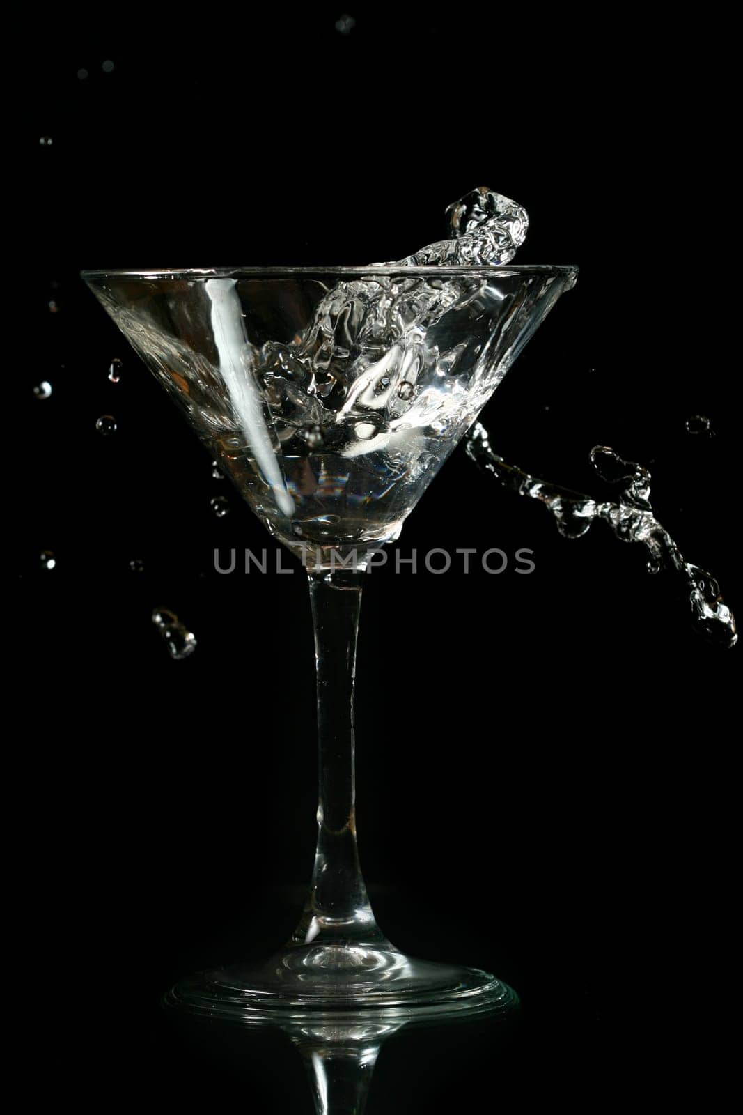 martini splash on black background close up