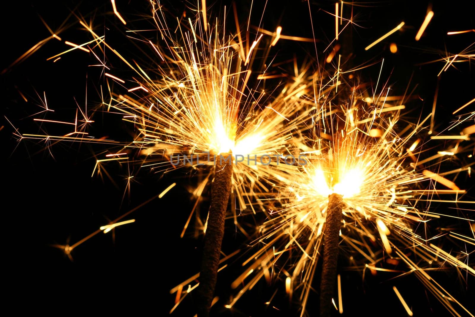 christmas celebration sparklers on black background
