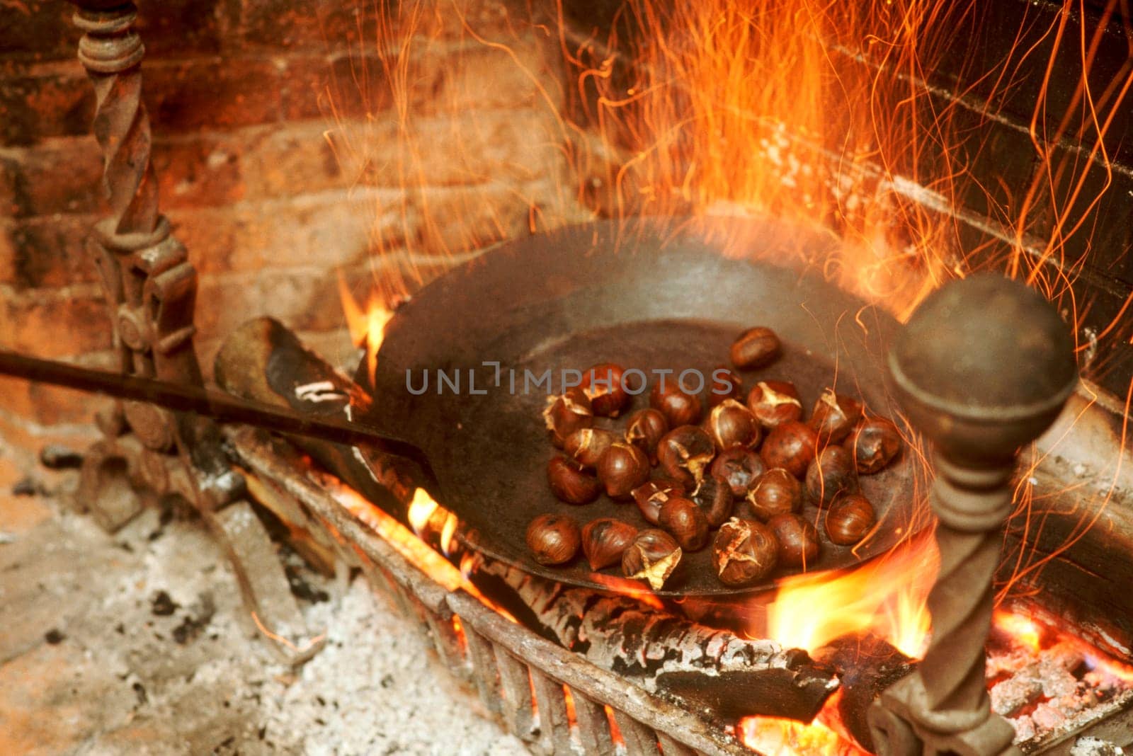 Chestnuts roasting on an open fire.  Weathersfield Inn, Weathersfield, VT.  New England USA