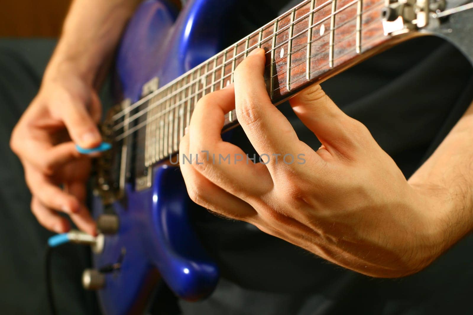 man play solo on blue guitar
