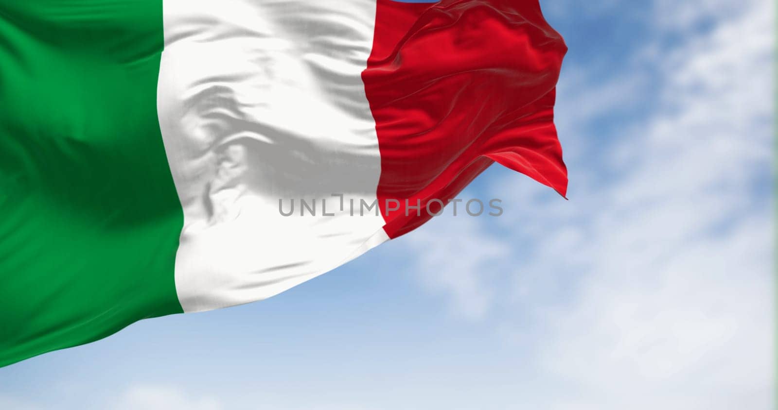 Italy national flag waving in the wind on a clear day. Three vertical bands of green, white and red. 3d illustration render. Rippled textile