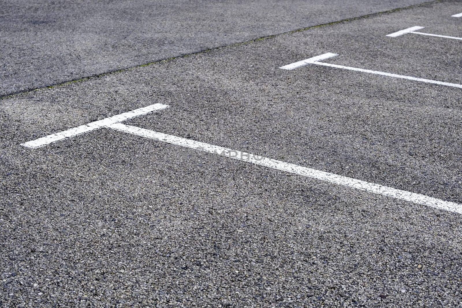 Detail of parking lines in a public parking lot, road signs