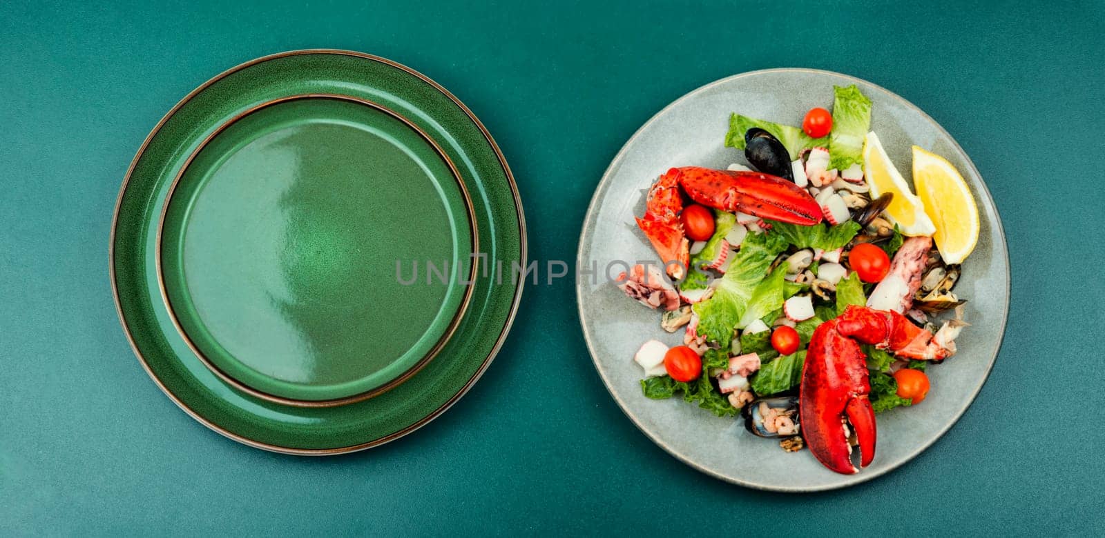 Appetizing salad of oysters, mussels, lobster and vegetables.