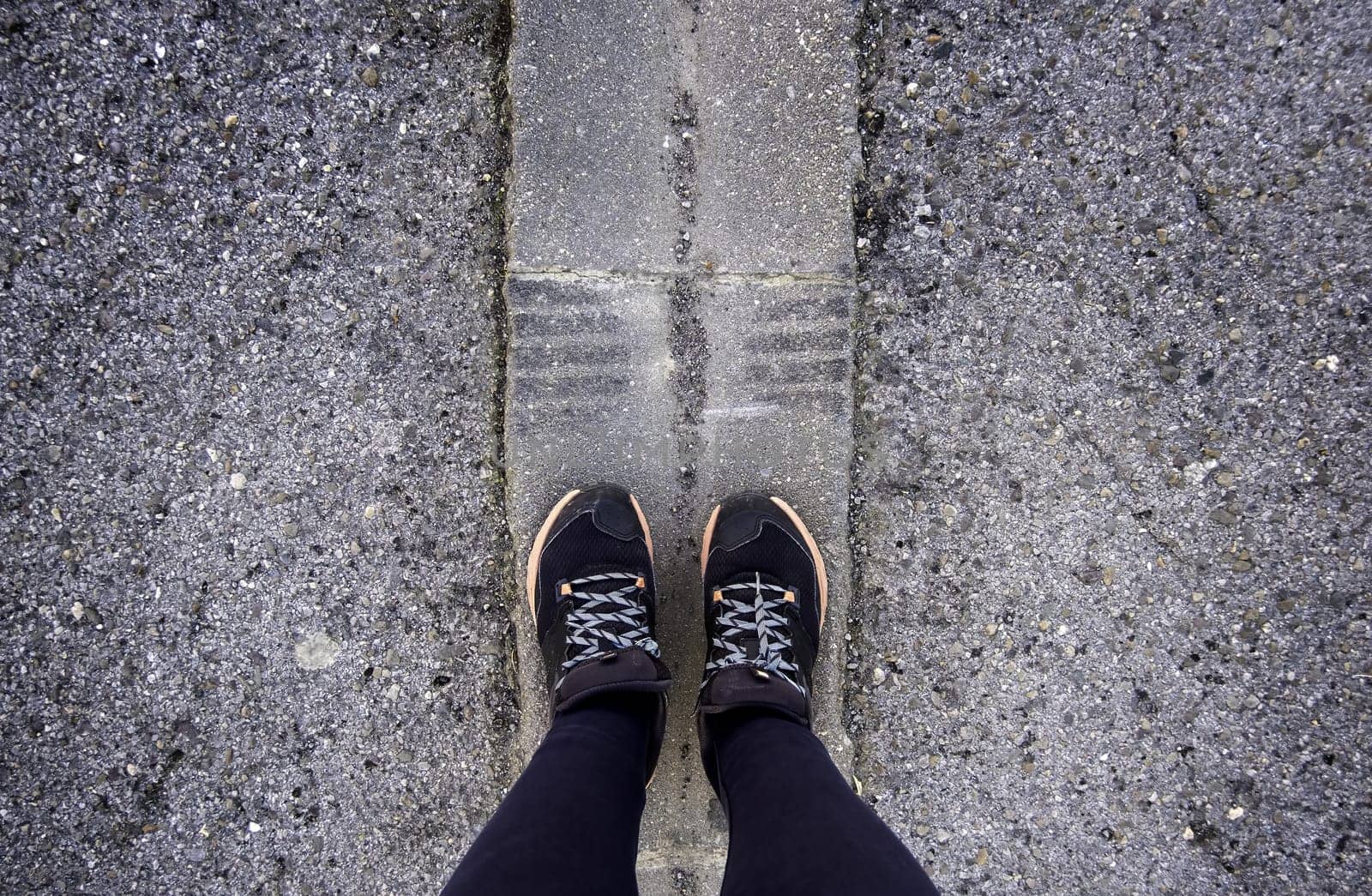 Detail of legs of young woman on a street in the city, walk and health