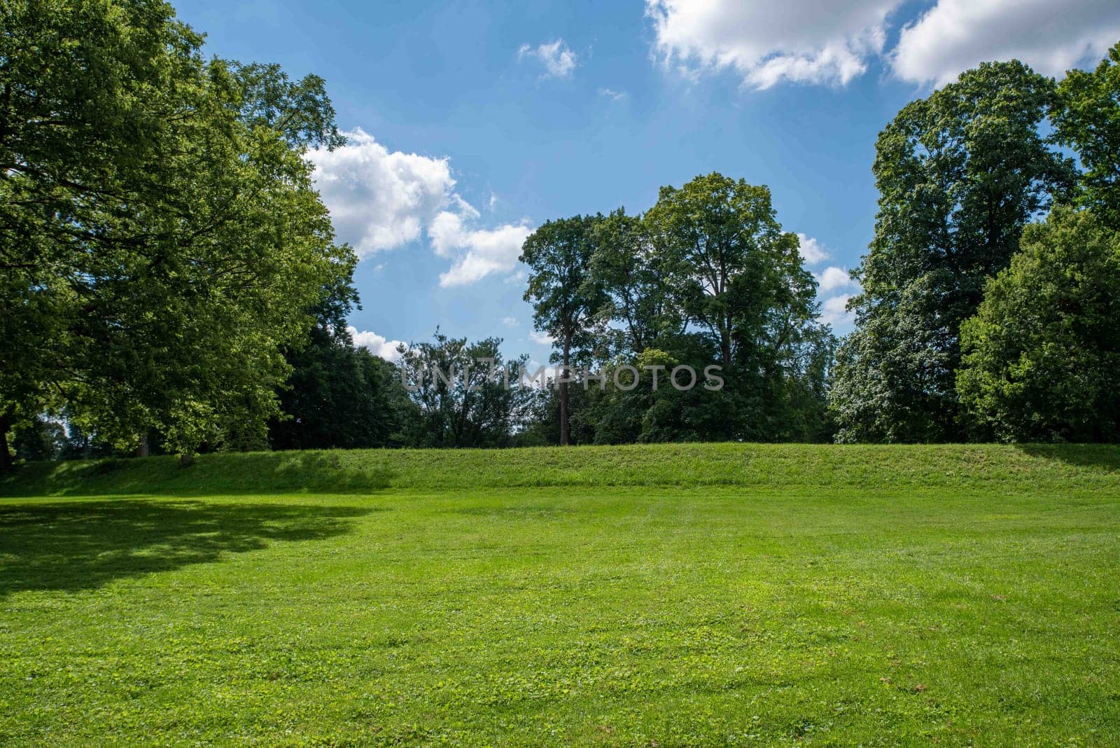 An exterior side view of the the Great Circle at the Native American Newark Earthworks built by prehistoric indigenous people in Ohio. Green grass, sunny outdoors with no people and copy space.
