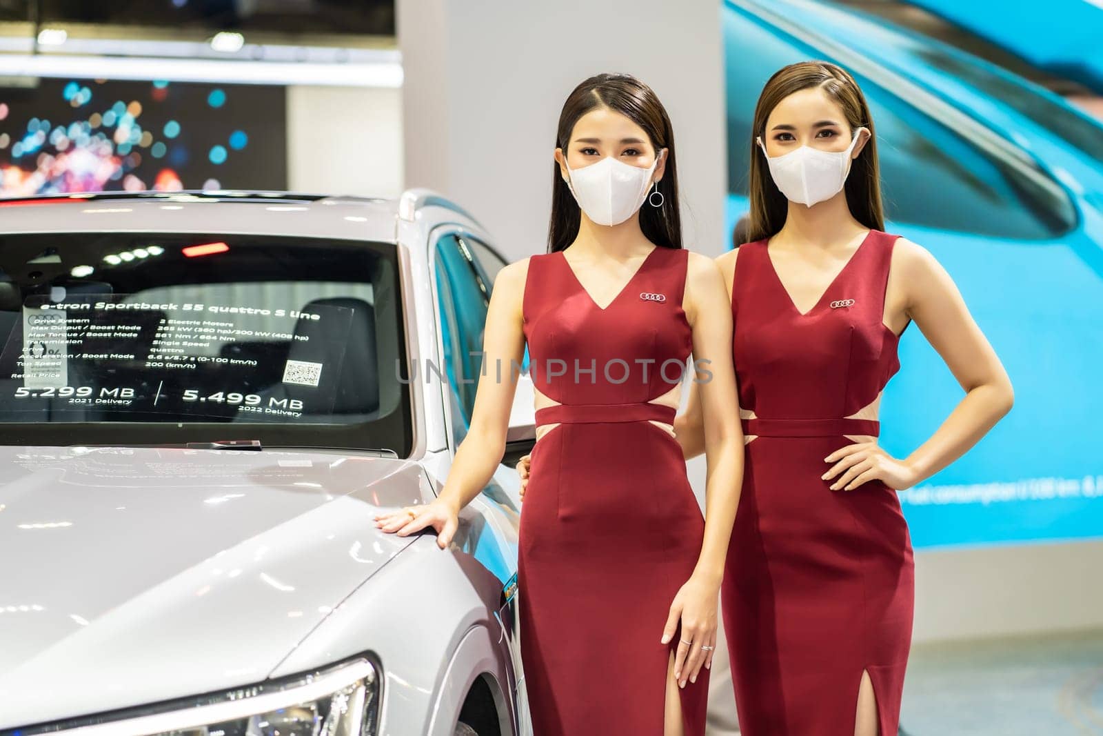Nonthaburi, Thailand - DEC 4, 2021 - Unidentified model poses with a car at The 38th Motor Expo Thailand 2021 at IMPACT Arena, Muang Thong Thani, Nonthaburi, Thailand.