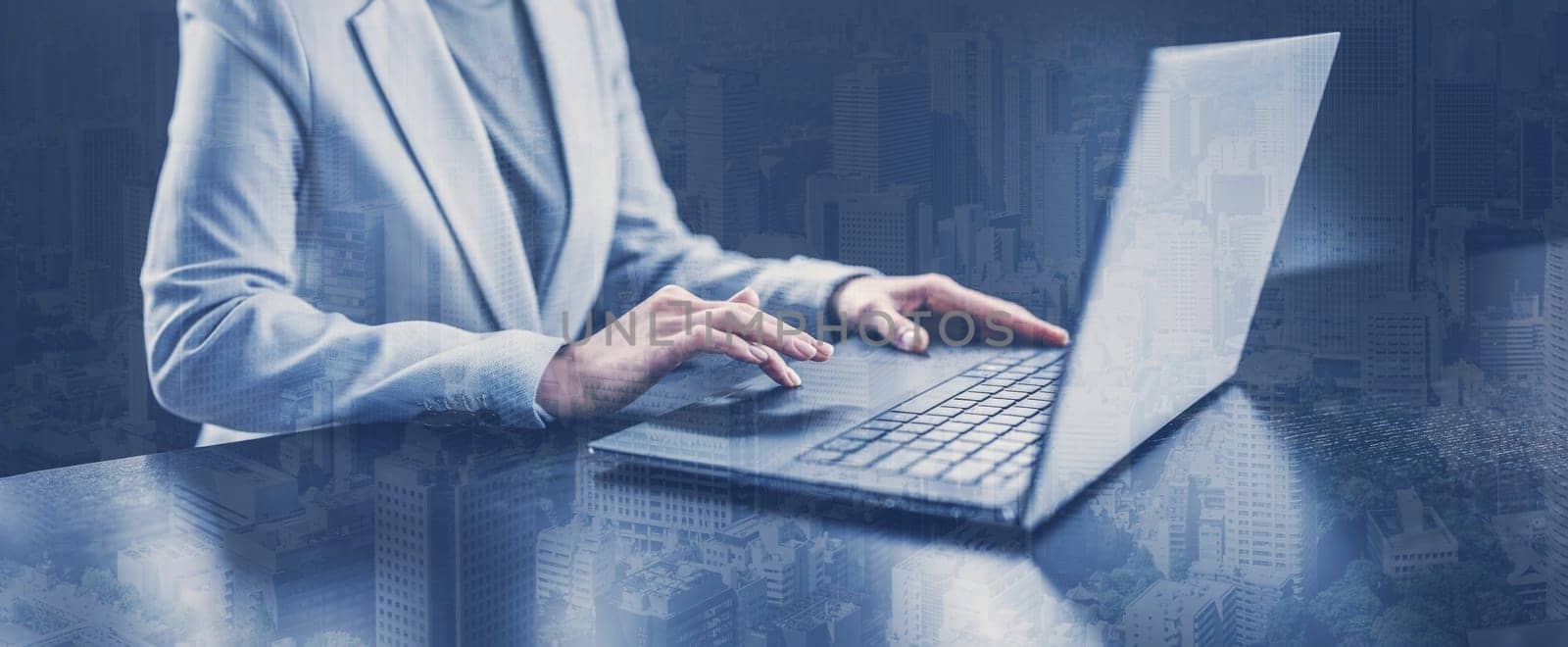 Woman with her laptop in the office and working. Concept of the global business.