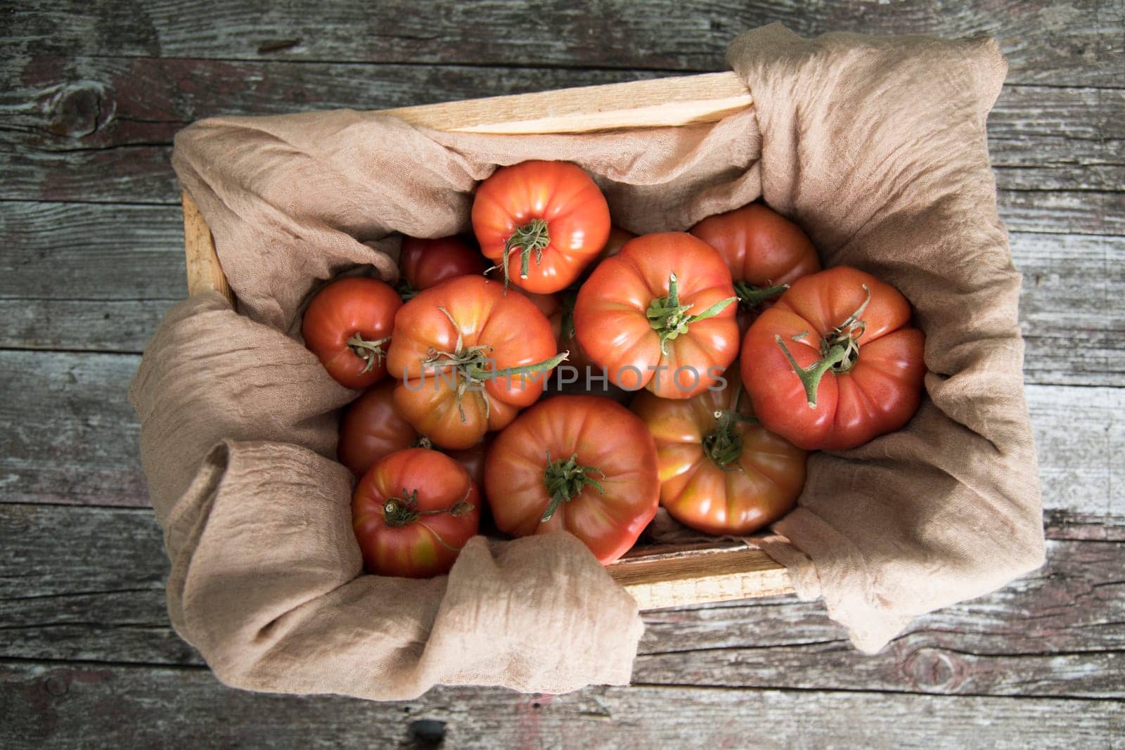 Vegetables, tomatoes on wooden desk