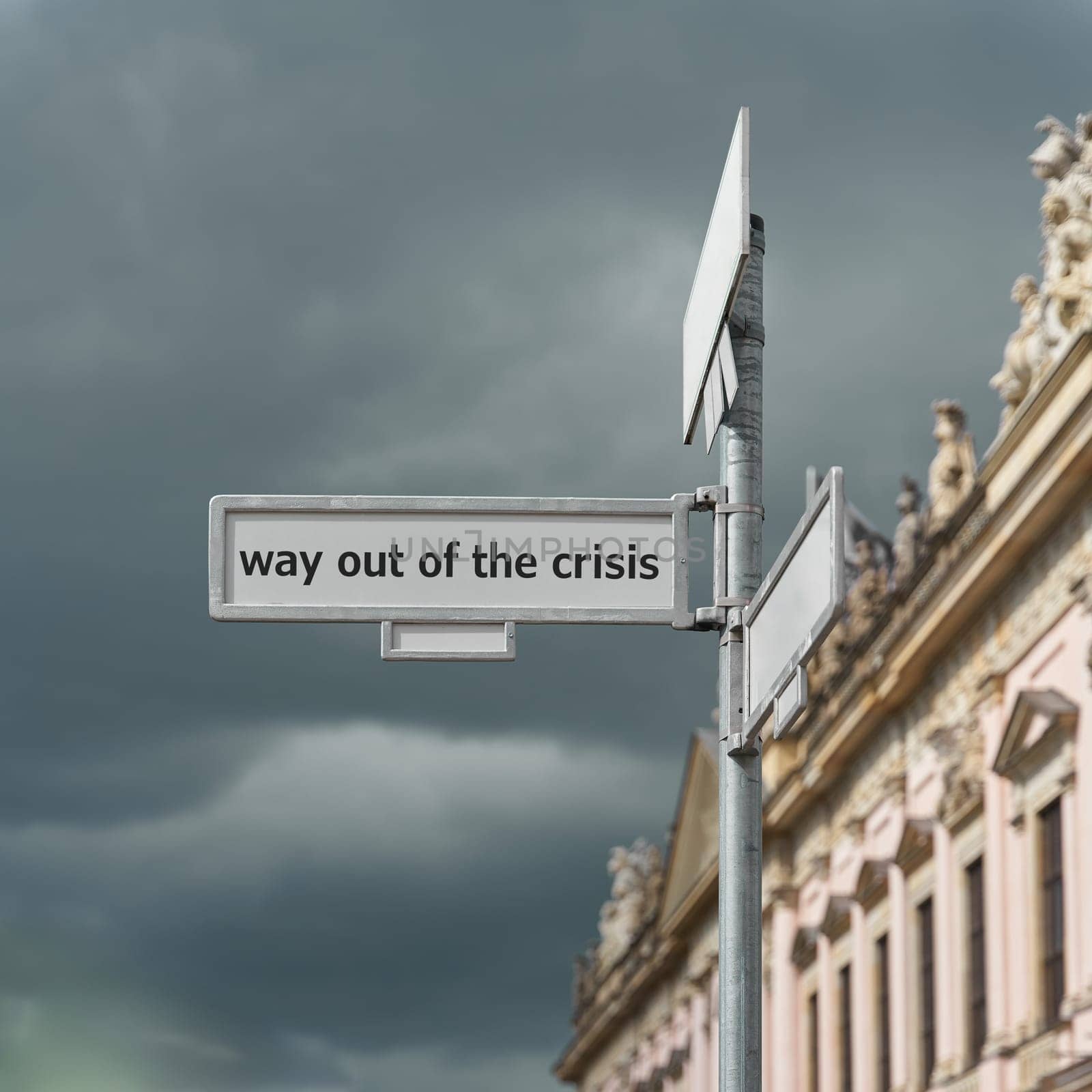 Road sign with the inscription way out of the crisis
