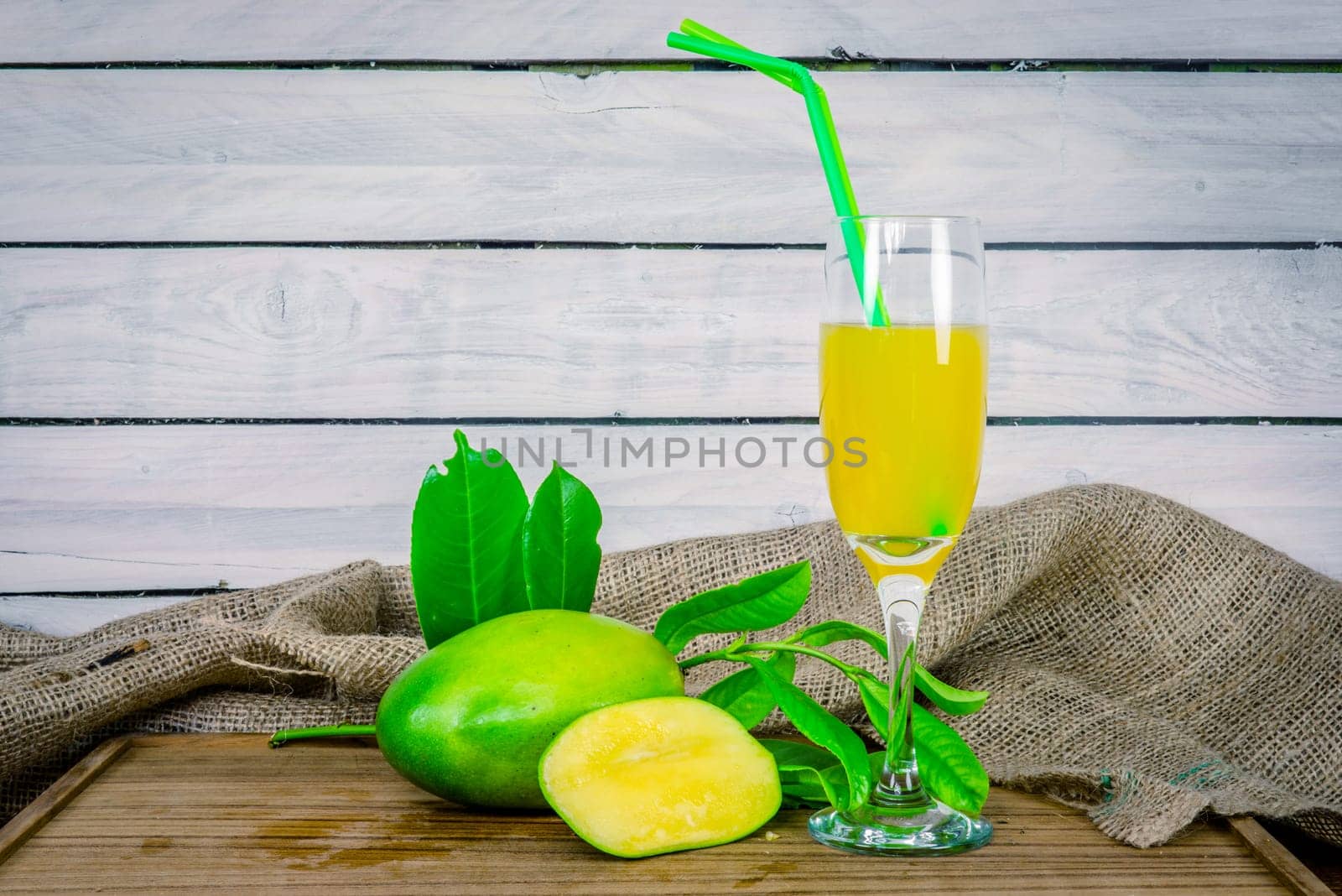 Green mango juice on a wooden table