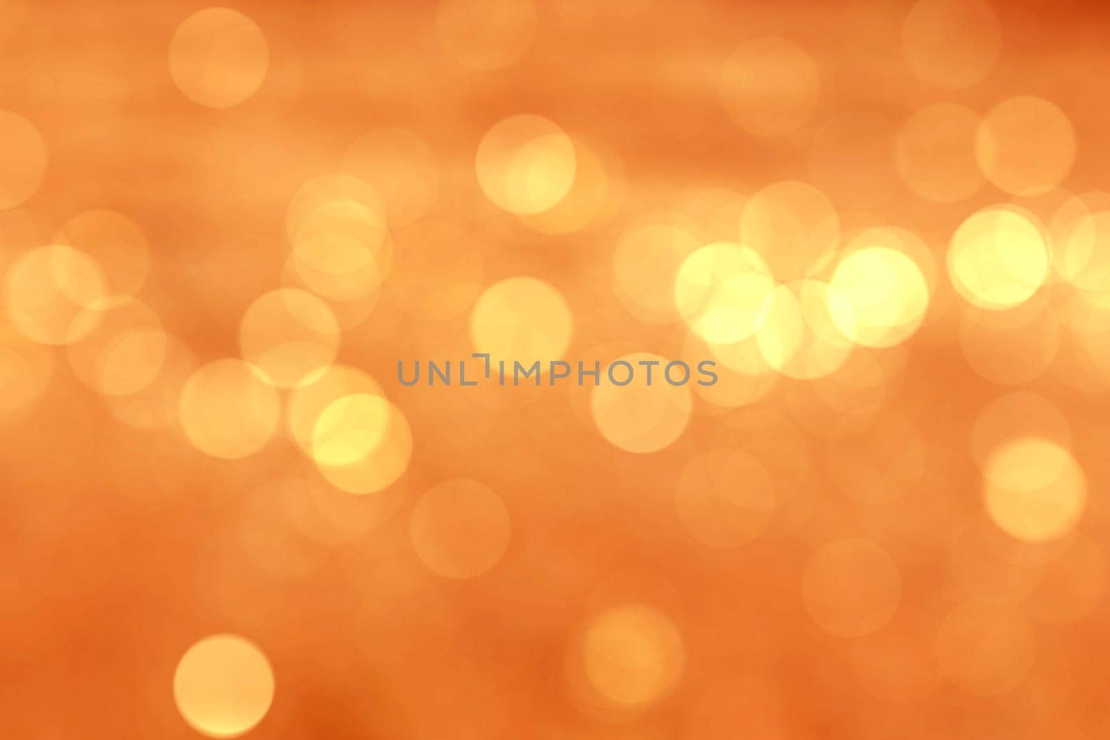 Abstract circular natural light orange bokeh background