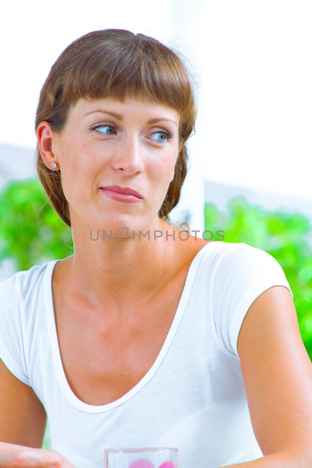 High key portrait of nice young woman  in summer environment
