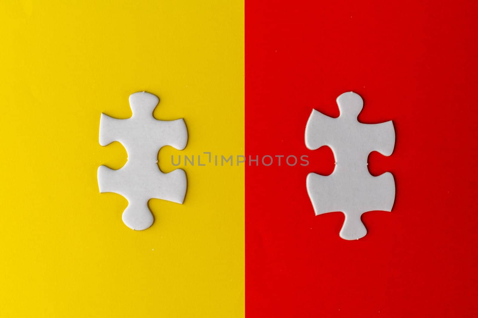 Pieces of white jigsaw puzzle on two different background