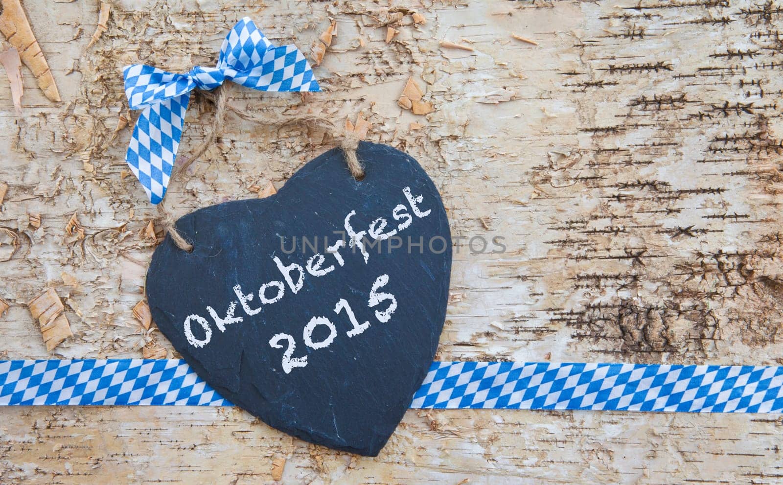 Rustic background made of birch bark with heart of slate