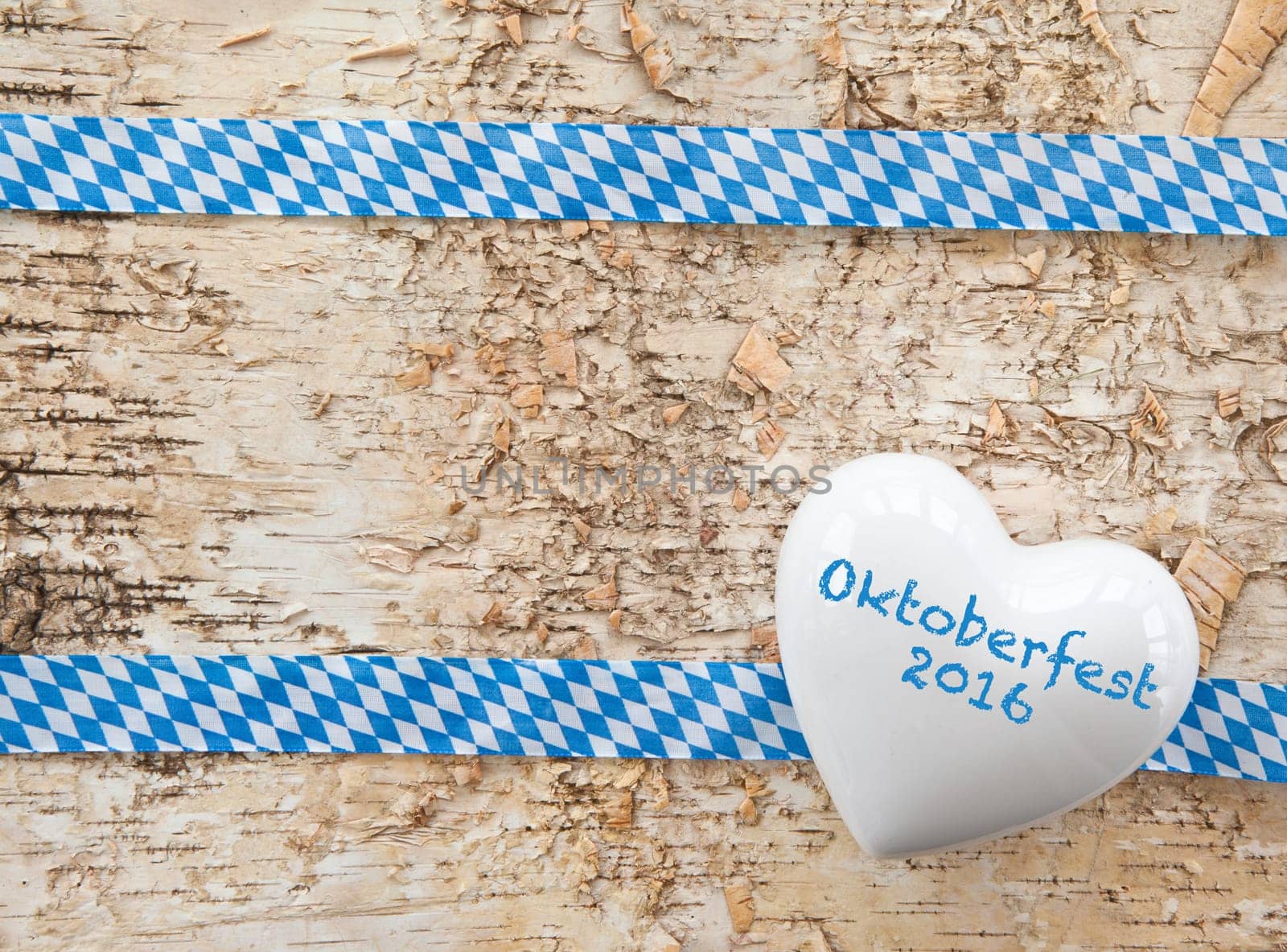 Rustic background with bavarian white and blue ribbon