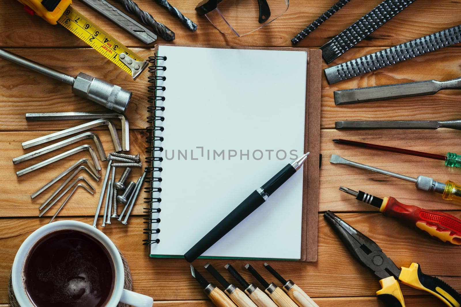 tools equipment with coffee and notebook on wood
