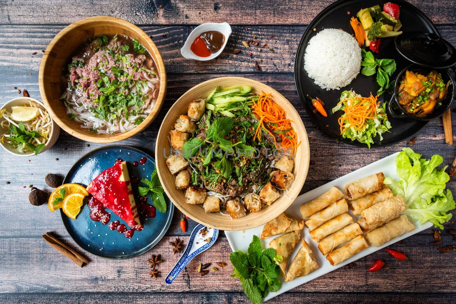Mixed and tasted asian food on a wooden tablefood